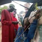 PHOTO: Nigerian man strapped  along with luggage in boot of bus to beat transport fare 