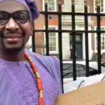 VIDEO: Man protesting Kemi Badenoch’s denigration of Nigeria, replaces her brother’s alleged stolen shoe, wristwatch