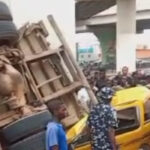 Truck skids off Pen Cinema Bridge in Lagos, lands on 2 commercial buses